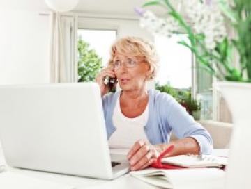 Woman looking concerned on laptop